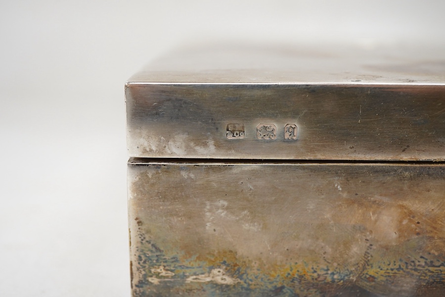 A George V silver mounted rectangular cigarette box, Sampson Mordan & Co, London, 1931, 17cm, with engraved monogram to the cover.